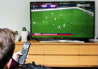 Couple watching a football game on TV