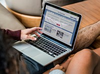 Couple using laptop together