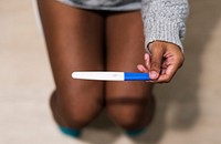 Woman with a pregnancy test