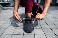 Sporty person checking shoelaces