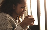 Woman having a warm cup of coffee