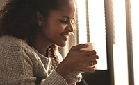 Woman having a warm cup of coffee