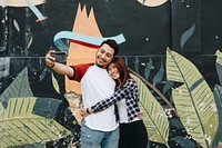 Cute couple taking a selfie outdoors