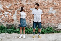Asian couple holding hands together