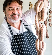 Butcher selling sausages on a string