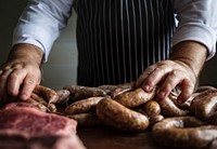 A chef preparing sausages food photography recipe idea