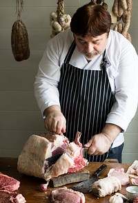Butcher cutting rib eye steak food photography recipe idea