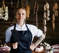 Female butcher selling meat in a butcher shop food photography recipe idea