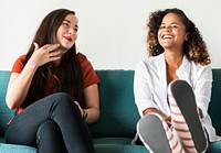 Girls talking together on couch