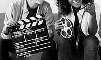 Young women with movie film reel