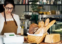 Bakery shop owner standing at counter
