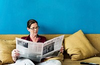 Caucasian woman reading the newspaper