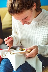 Young girl doing some needlework