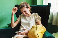 Caucasian woman using phone in living room