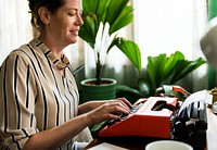 Woman typing on a retro typewriter