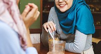 Islamic women friends enjoying and talking in the coffee shop