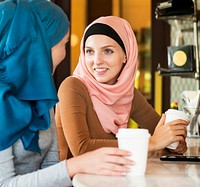 Muslim women enjoying and talking in the coffee shop