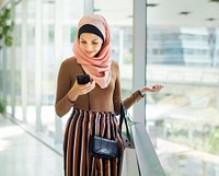 Islamic woman looking on the phone