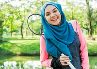 Muslim woman with badminton racket