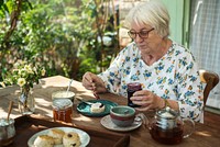 Senior woman having scones for breakfast