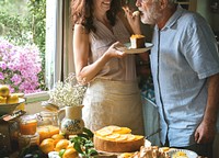 Lovely couple baking cheescake in the kitchen