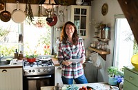 Happy woman reading a recipe on a screen