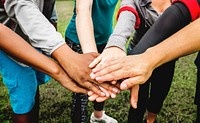 Diverse people stacking their hands