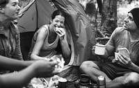 Group of friends camping in the forest