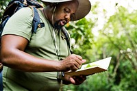 Botanist making notes in his notepad