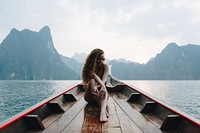 Beautiful woman posing on a boat