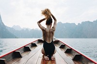 Beautiful woman posing on a boat