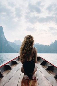Beautiful woman posing on a boat