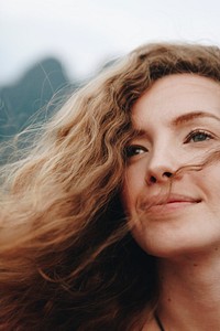 Portrait of a beautiful woman with curly hair