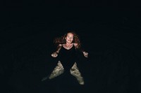 Woman swimming in the dark