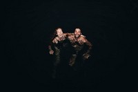 Couple playing in the dark water