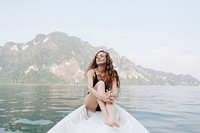 Woman relaxing on a canoe at a lake