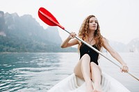 Woman paddling a canoe through a national park