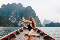 Beautiful woman posing on a boat