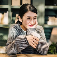 Japanese woman having a coffee