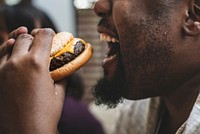 Man eating a big hamburger