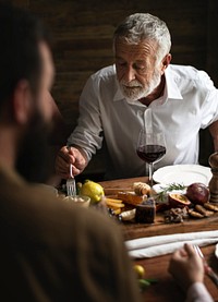 Man eating at a dinner table