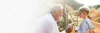 Granddad and grandson at a countryside farm design space banner 