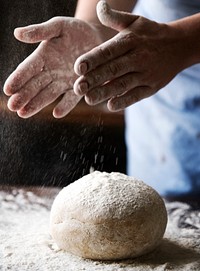 Housewife making a dough for a bread