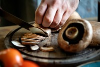 Man slicing portobello mushrooms