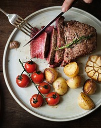 Close up of a cutting a fillet steak food photography recipe idea