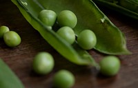 Close up of a green pea pod food photography recipe idea