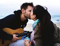 Couple kissing at the beach