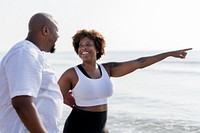 African American couple working out at the beach