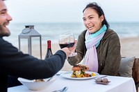 Couple enjoying a romantic dinner at the beach