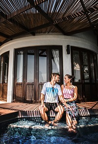 Couple relaxing in a swimming pool